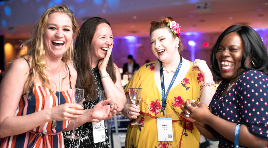 Four women celebrating at the Annual GS Alumni Dinner at Columbia Reunion