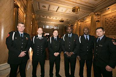 Six veterans pose during the reception