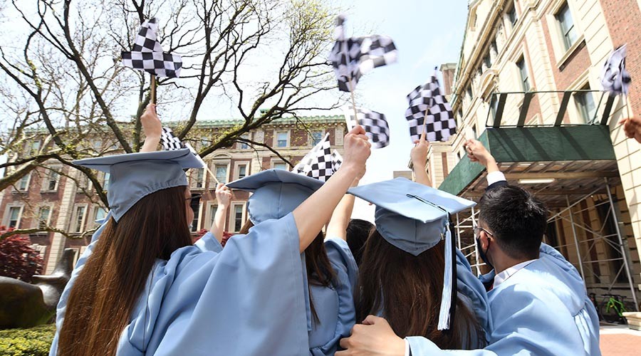 Students gather safely on campus to celebrate their graduation