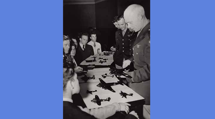 Students look at model airplanes at an Army Air Corps recruiting event in May 1942