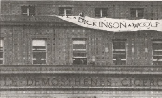 Then-GS student Laura Hotchkiss Brown '89 unfurls banner on Butler Library featuring prominent women authors
