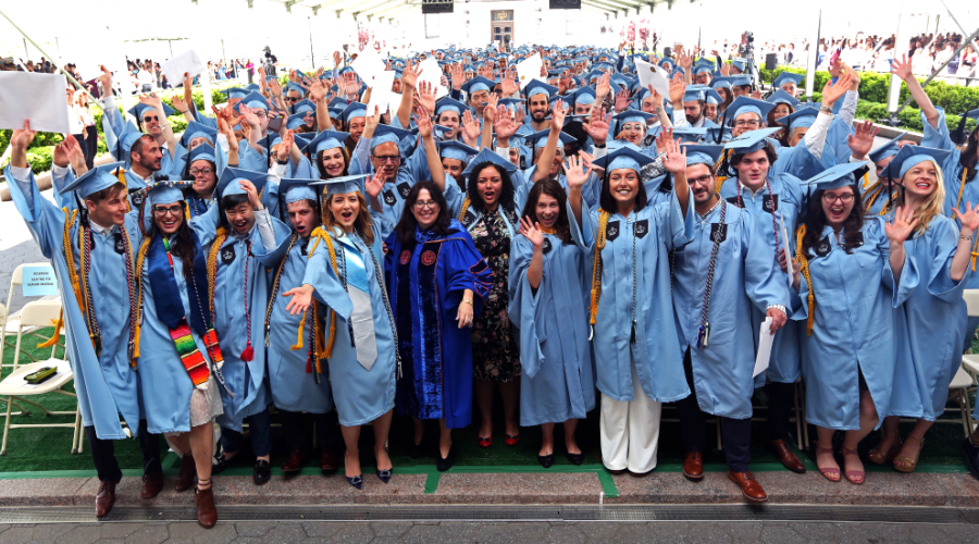GS Class of 2019 Hundreds of GS graduates in blue gowns celebrate under the graduation ceremony tent