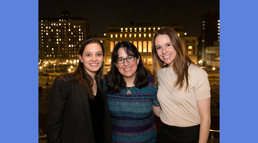 Dean Rosen-Metsch poses with GS Honor Society inductees, with Butler Library in the backround