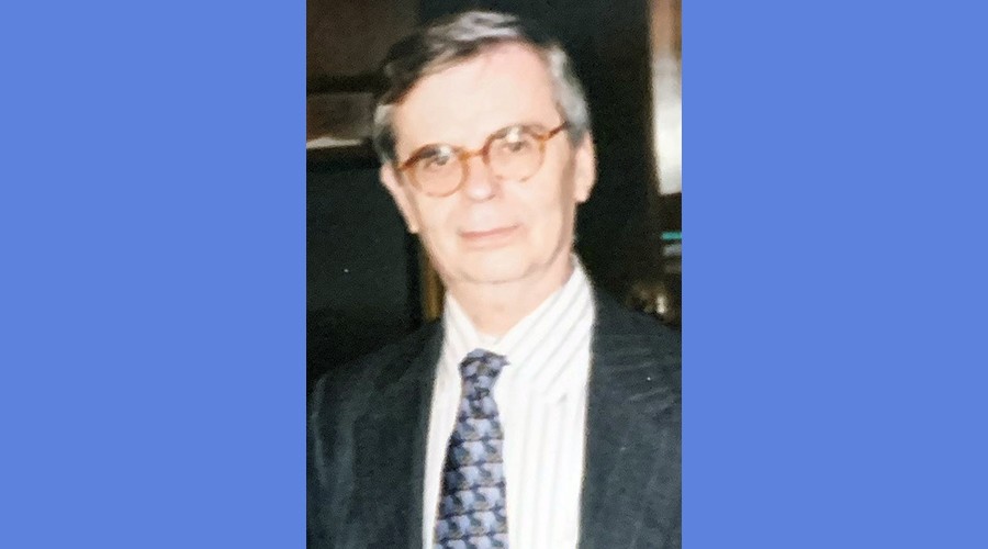Image of Joseph Kissane, former Dean of Students at the Columbia University School of General Studies from the chest up, wearing glasses, a coat, and tie