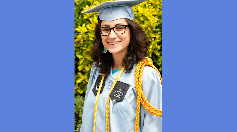 Nur Arafeh in her blue Columbia graduation gown