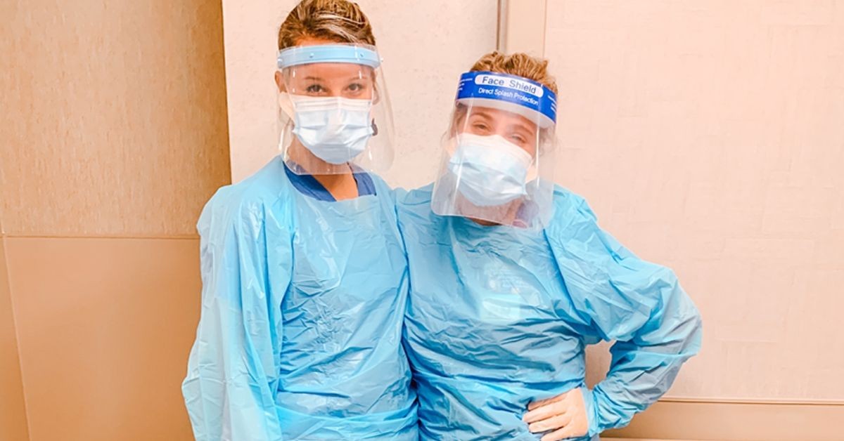 Postbac Premed student Karianne Weber with a co-worker.
