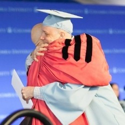 Satz and the late Dean Awn embrace at GS Class Day Satz with late Dean Awn at graduation